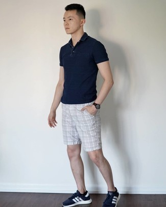 Silver Shorts Outfits For Men: This combination of a navy polo and silver shorts is pulled together and yet it looks casual enough and ready for anything. Unimpressed with this ensemble? Invite a pair of navy and white athletic shoes to change things up a bit.