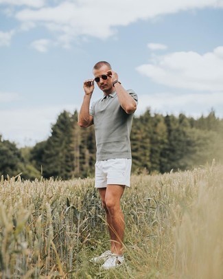 Grey Polo Outfits For Men: A grey polo and white shorts are both versatile menswear must-haves that will integrate perfectly within your day-to-day off-duty arsenal. Complete this look with a pair of white print canvas low top sneakers for maximum effect.
