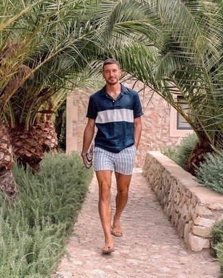 Aquamarine Shorts Outfits For Men: A navy and white polo and aquamarine shorts are absolute menswear must-haves if you're crafting an off-duty wardrobe that matches up to the highest style standards. Amp up your getup by rocking tan suede sandals.