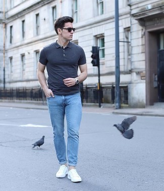 Charcoal Polo Outfits For Men: Pairing a charcoal polo with light blue skinny jeans is an amazing pick for an off-duty but seriously stylish ensemble. Elevate your getup with the help of a pair of white canvas low top sneakers.