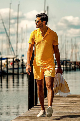 Mustard Polo Outfits For Men: Infuse some fun into your day-to-day styling routine with a mustard polo and mustard swim shorts. And it's amazing how beige suede slip-on sneakers can change an ensemble.