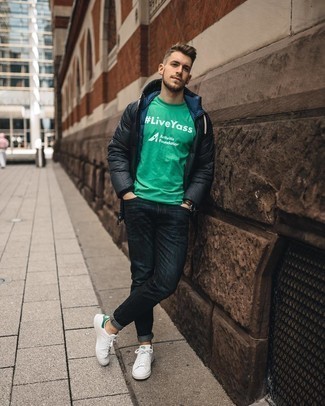 Charcoal Puffer Coat Outfits For Men: This combo of a charcoal puffer coat and navy jeans is definitive proof that a safe casual outfit can still look incredibly dapper. Let your outfit coordination chops truly shine by finishing off your outfit with white and green leather low top sneakers.