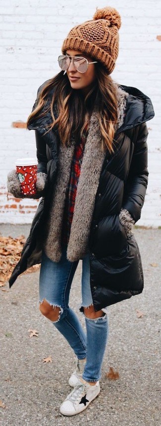Black Puffer Coat Outfits For Women: This casual pairing of a black puffer coat and blue ripped skinny jeans is super easy to throw together in no time, helping you look amazing and ready for anything without spending a ton of time searching through your wardrobe. A pair of white star print low top sneakers looks fabulous rounding off your look.