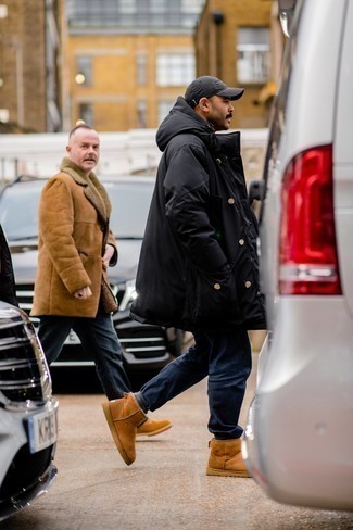 Uggs Outfits For Men: A black puffer coat and navy jeans are an easy way to introduce effortless cool into your daily lineup. When it comes to footwear, go for something on the relaxed end of the spectrum and complete this ensemble with a pair of uggs.