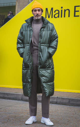 Yellow Beanie Outfits For Men: Team a dark green puffer coat with a yellow beanie, if you prefer to dress for comfort but also like to look dapper. Bump up your whole look by wearing white canvas low top sneakers.