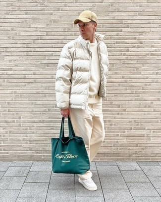 Beige Baseball Cap Outfits For Men: Why not reach for a white puffer jacket and a beige baseball cap? Both items are super practical and will look amazing together. If you want to break out of the mold a little, introduce a pair of white leather low top sneakers to this outfit.