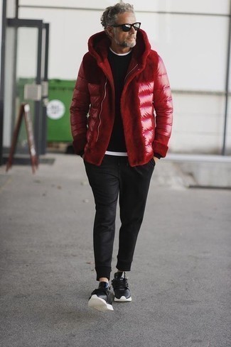 Red Puffer Jacket Outfits For Men: This smart casual combination of a red puffer jacket and black chinos can take on different nuances according to the way you style it out. Inject a dressed-down feel into this outfit with a pair of black athletic shoes.