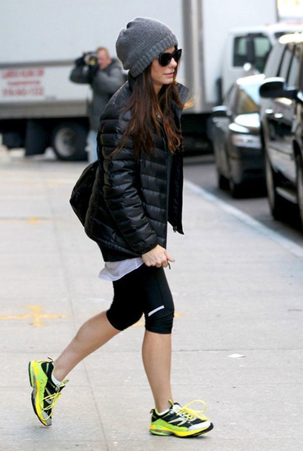 Sandra Bullock wearing Black Puffer Jacket, Black Crew-neck Sweater, White Crew-neck T-shirt, Black Leggings | Lookastic