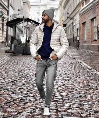 Men's White Puffer Jacket, Navy Crew-neck Sweater, Grey Jeans, White Canvas Low Top Sneakers