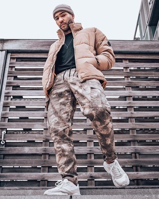 Brown Camouflage Cargo Pants Outfits: One of the coolest ways for a man to style a tan puffer jacket is to combine it with brown camouflage cargo pants for a laid-back getup. A pair of beige athletic shoes immediately ups the style factor of this look.