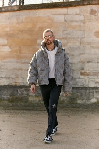 Grey Puffer Jacket Outfits For Men: Putting together a grey puffer jacket with black chinos is an on-point idea for an effortlessly neat getup. A good pair of white and black athletic shoes is the simplest way to infuse a sense of stylish effortlessness into your look.