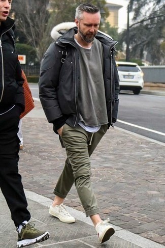 White Print Canvas Low Top Sneakers Outfits For Men: A black puffer jacket and olive chinos are absolute must-haves if you're picking out a smart casual closet that holds to the highest sartorial standards. And it's a wonder how white print canvas low top sneakers can spice up a look.