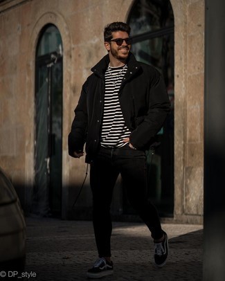 Black Puffer Jacket Outfits For Men: Step up your laid-back style by wearing a black puffer jacket and black skinny jeans. Introduce black and white canvas low top sneakers to the equation and you're all done and looking boss.