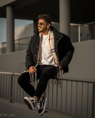 Beige Plaid Scarf Outfits For Men: Rock a black puffer jacket with a beige plaid scarf for a fashionable and urban outfit. Balance out your ensemble with a more sophisticated kind of shoes, like these black and white canvas low top sneakers.