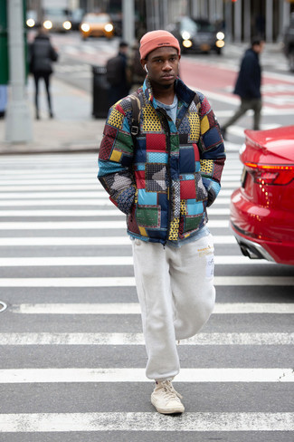 White Sweatpants Cold Weather Outfits For Men: For comfort dressing with a twist, you can dress in a multi colored print puffer jacket and white sweatpants. And if you wish to effortlessly dress down your ensemble with footwear, opt for a pair of beige canvas high top sneakers.