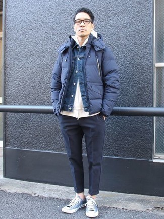 Navy Chinos Outfits: For a look that's city-style-worthy and casually sleek, dress in a navy puffer jacket and navy chinos. Add a confident kick to the look with blue canvas low top sneakers.