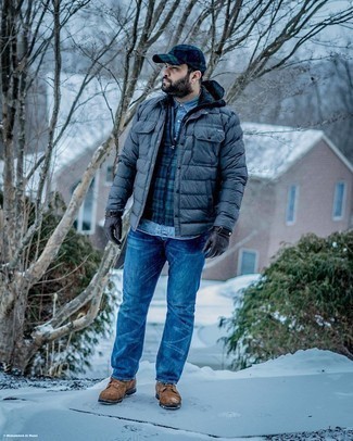 Brown Boots Outfits For Men: For an effortlessly sleek look, opt for a charcoal puffer jacket and navy jeans — these two pieces go pretty good together. As for footwear, introduce a pair of brown boots to the mix.