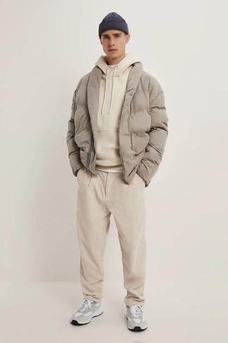 Tan Hoodie Outfits For Men: This pairing of a tan hoodie and beige corduroy chinos spells laid-back attitude and comfortable menswear style. Why not complete your outfit with grey athletic shoes for a mellow feel?