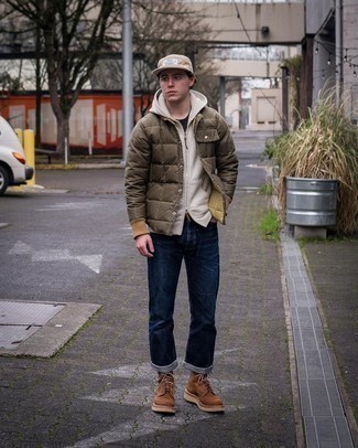 Beige Baseball Cap Outfits For Men: We all want functionality when it comes to styling, and this contemporary combination of an olive puffer jacket and a beige baseball cap is a good illustration of that. Play up the formality of this outfit a bit with a pair of brown suede casual boots.