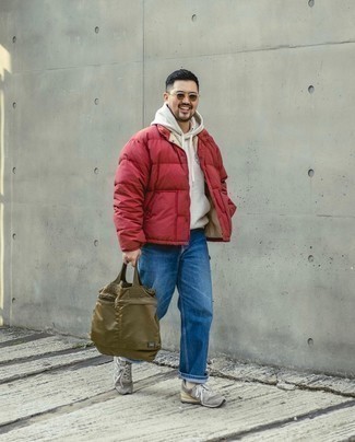 1200+ Cold Weather Outfits For Men: This semi-casual combo of a red puffer jacket and blue jeans is very easy to put together in next to no time, helping you look amazing and prepared for anything without spending too much time going through your wardrobe. Introduce a pair of grey athletic shoes to the equation to add a hint of stylish casualness to this ensemble.