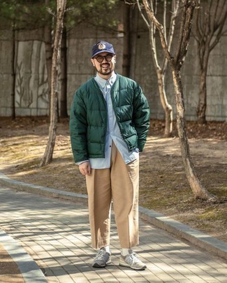 Navy Print Baseball Cap Outfits For Men: We all look for functionality when it comes to styling, and this off-duty combination of a dark green puffer jacket and a navy print baseball cap is an amazing example of that. A pair of grey athletic shoes looks perfectly at home paired with this ensemble.