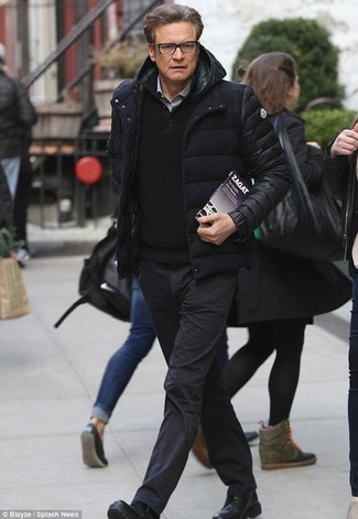 Colin Firth wearing Black Puffer Jacket, Black Mock-Neck Sweater, Grey Long Sleeve Shirt, Black Chinos