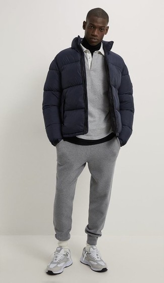Grey Sweatpants Outfits For Men: For a neat and relaxed outfit, opt for a navy puffer jacket and grey sweatpants — these pieces fit really well together. Rock a pair of grey athletic shoes to easily dial up the appeal of this getup.