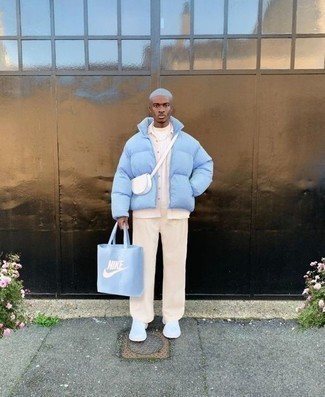 Light Blue Print Canvas Tote Bag Outfits For Men: Rock a light blue puffer jacket with a light blue print canvas tote bag for an ensemble that's both contemporary and practical. A pair of white athletic shoes looks perfectly at home paired with this outfit.