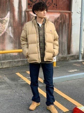 Beige Puffer Jacket Outfits For Men: Try pairing a beige puffer jacket with navy jeans to look refined but not too formal. Tan suede low top sneakers are a fail-safe way to bring a sense of stylish effortlessness to this outfit.