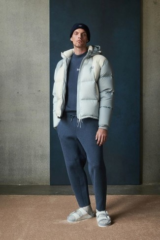 White Sandals Outfits For Men: Wear a grey puffer jacket with a navy track suit to feel 100% confident in yourself and look laid-back and cool. Rounding off with white sandals is a fail-safe way to inject a mellow touch into this ensemble.