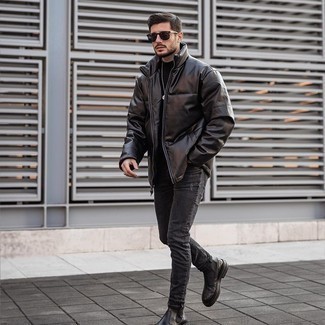Black Ripped Skinny Jeans Outfits For Men: A dark brown leather puffer jacket and black ripped skinny jeans are an easy way to infuse some cool into your day-to-day styling routine. Take your getup down a classier path by finishing off with a pair of black leather chelsea boots.