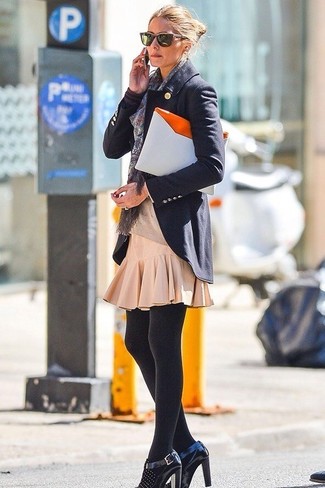 Olivia Palermo wearing White Leather Clutch, Black Embellished Leather Pumps, Beige Pleated Mini Skirt, Navy Blazer