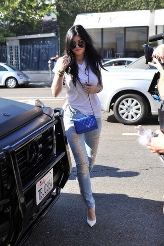 Kylie Jenner wearing Blue Quilted Leather Crossbody Bag, White Leather Pumps, Light Blue Ripped Skinny Jeans, White Crew-neck T-shirt