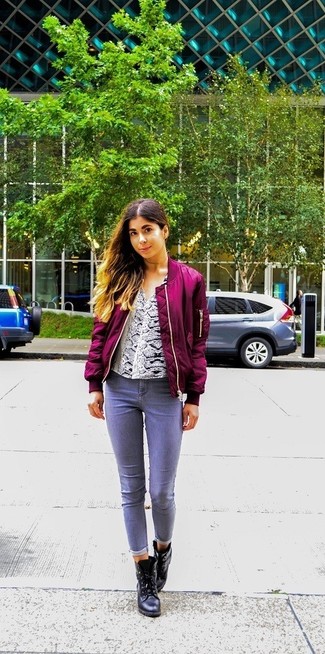 Black Leather Ankle Boots Outfits: Combining a purple bomber jacket with grey jeans is a great choice for a laid-back and cool ensemble. To add some extra flair to this look, introduce a pair of black leather ankle boots to the equation.