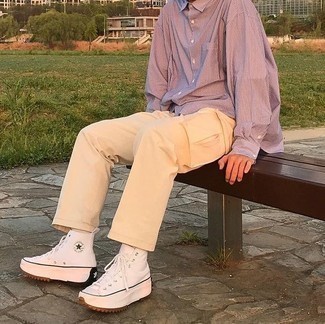 Beige Cargo Pants Outfits: A purple vertical striped long sleeve shirt and beige cargo pants are absolute menswear must-haves if you're planning an off-duty wardrobe that matches up to the highest sartorial standards. Balance out this look with more laid-back footwear, like these white canvas high top sneakers.