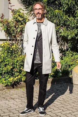 Grey Raincoat Outfits For Men: For a casual getup, make a grey raincoat and black chinos your outfit choice — these items work nicely together. Our favorite of an infinite number of ways to finish this outfit is a pair of black and white canvas low top sneakers.