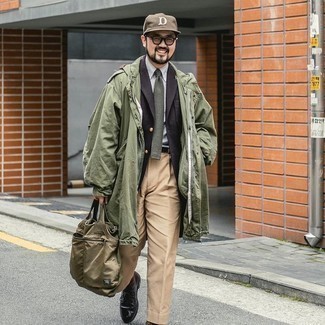 Olive Raincoat Outfits For Men: When it comes to high-octane polish, this combination of an olive raincoat and khaki dress pants never disappoints. Break up this outfit by slipping into black leather derby shoes.