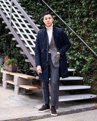 Charcoal Wool Dress Pants Outfits For Men: One of the most elegant ways to style out such a timeless menswear piece as a navy raincoat is to team it with charcoal wool dress pants. When this ensemble is just too much, tone it down by slipping into dark brown suede low top sneakers.