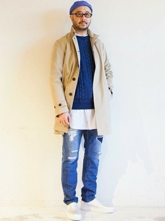 Beige Raincoat Outfits For Men: Who said you can't make a fashionable statement with a bold casual outfit? Draw the attention in a beige raincoat and blue ripped jeans. Clueless about how to complement this look? Wear white leather slip-on sneakers to spruce it up.