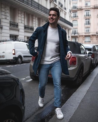 White Crew-neck Sweater Casual Outfits For Men: For an outfit that provides function and fashion, wear a white crew-neck sweater with blue jeans. Rock a pair of white canvas low top sneakers and the whole ensemble will come together.
