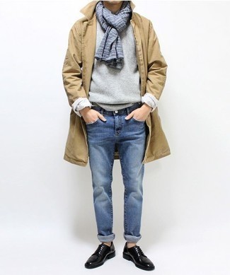 Beige Raincoat Outfits For Men: A beige raincoat and blue jeans will give off this relaxed and dapper vibe. Complete this ensemble with black leather derby shoes to make the ensemble a bit more polished.