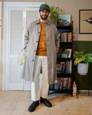Charcoal Raincoat Outfits For Men: This laid-back combination of a charcoal raincoat and white chinos is a safe option when you need to look casually dapper but have no extra time. Rounding off with a pair of black leather chelsea boots is an effective way to infuse a dose of elegance into your outfit.