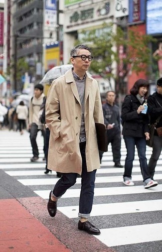 Beige Raincoat Outfits For Men: Such pieces as a beige raincoat and navy jeans are an easy way to introduce toned down dapperness into your current collection. Our favorite of a multitude of ways to finish off this getup is with a pair of dark brown leather derby shoes.