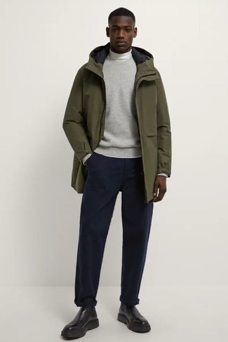 Boots Outfits For Men: Why not consider wearing an olive raincoat and navy chinos? As well as very practical, both of these items look good worn together. If you want to immediately perk up your ensemble with one item, complete this outfit with boots.