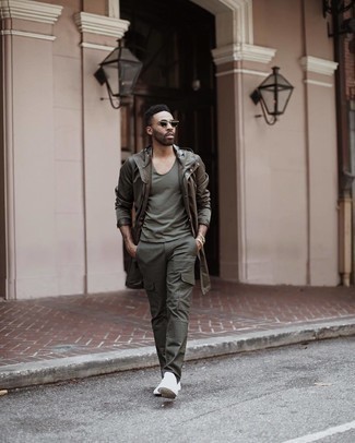Dark Green Cargo Pants Outfits: Why not make an olive raincoat and dark green cargo pants your outfit choice? As well as super functional, both pieces look awesome paired together. Let your sartorial chops truly shine by finishing your getup with a pair of white canvas low top sneakers.