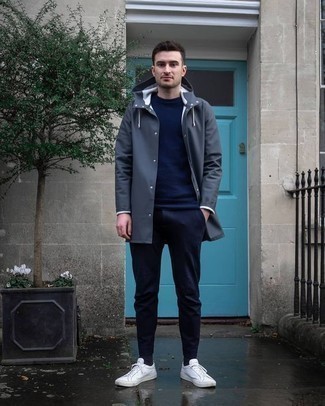 Charcoal Raincoat Outfits For Men: For an ensemble that provides practicality and fashion, team a charcoal raincoat with navy chinos. White canvas low top sneakers are a smart option to finish your look.
