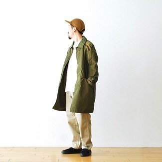 Olive Raincoat Outfits For Men: Inject personality into your current off-duty arsenal with an olive raincoat and khaki chinos. Consider black canvas low top sneakers as the glue that will bring your look together.