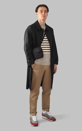 Black Raincoat Outfits For Men: A black raincoat and khaki chinos are great menswear staples that will integrate nicely within your daily routine. Grey athletic shoes are an easy way to infuse a touch of stylish casualness into this outfit.