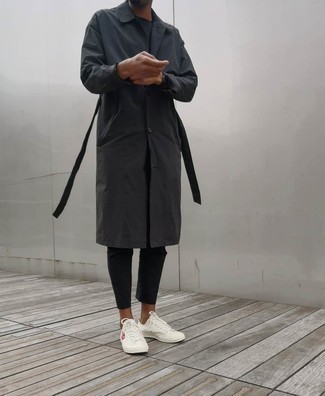 Charcoal Raincoat Outfits For Men: The combination of a charcoal raincoat and black chinos makes this a solid off-duty outfit. Complement this outfit with a pair of white print canvas low top sneakers and you're all set looking incredible.