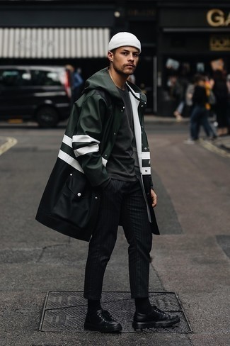 Dark Green Raincoat Outfits For Men: This pairing of a dark green raincoat and black vertical striped chinos is extremely easy to replicate and so comfortable to sport as well! Let your sartorial expertise really shine by finishing your getup with black leather low top sneakers.